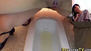 Hairy pussy asians piss into public toilet