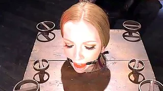 Tattooed bdsm sub toyed using dildo stick